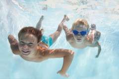 boys in swimming pool, underwater