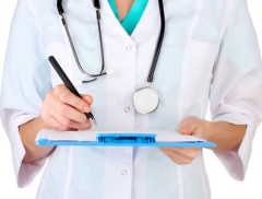 Hand of doctor with pen writing